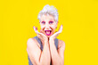 © Eugenio Marongiu - Senior woman isolated on yellow background shocked and surprised