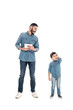 © LIGHTFIELD STUDIOS - Smiling hispanic man holding digital tablet while grandson talking on smartphone on white background, two generations of men