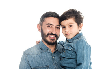 Wall Mural - Hispanic man smiling at camera near grandson isolated on white, two generations of men