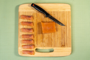 Poster - Top view shot of cut fish on a cutting board for sushi