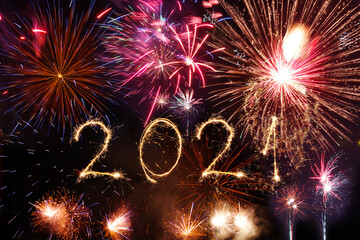 Wall Mural - Happy new year 2021 written with Sparkle firework on black background