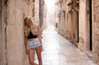 © Marko Cvetkovic - Young sexy tourist woman in the old town