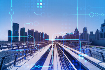 The way towards skyscrapers by modern futuristic train. Tech railway delivers commuters to the financial downtown of Dubai. Transportation tech railroad concept. Double exposure