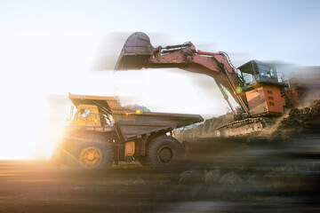 Wall Mural - Big yellow dump truck and excavator in coal mine 