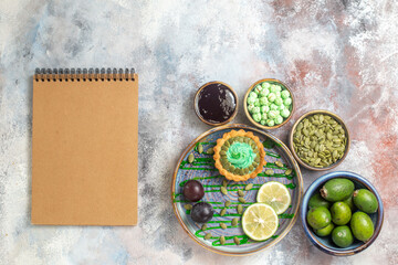 top view little creamy cake with fruits on the light background candy photo biscuit sweet