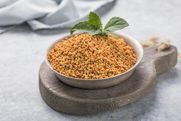 Organic fenugreek seeds in the bowl. Trigonella foenum-graecum