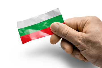 Hand holding a card with a national flag the Bulgaria