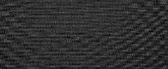 Synthetic black nylon fabric.Texture of dense black fabric.The background is nylon black.