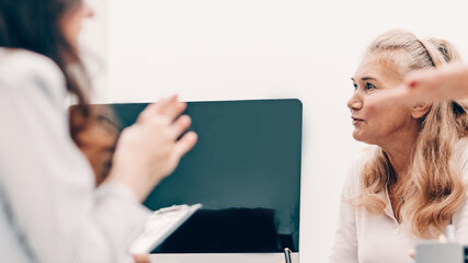 Canvas Print - working group discussing business documents at a working meeting