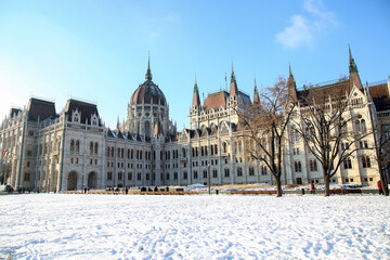 View of the parliament building in budapest on a sunny winter day. Snow in Budapest. Christmas new year.