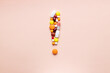 medicine assorted pills exclamation sign isolated over pink background. medical warning symbol. medical solution concept