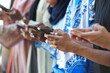 © .shock - multiethnic startup business people group using smart phones