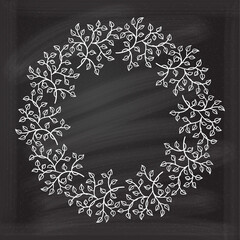Wall Mural - vector round frame with floral decoration on chalkboard background. herbal wreath.