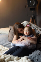 Wall Mural - Mother and daughter have fun together before christmas.