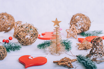 Festive composition for new year and christmas. Christmas tree with decoration on a wooden table.