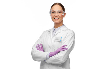 science and profession concept - happy smiling female scientist in goggles and gloves with nametag o