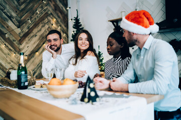 Wall Mural - Modern multiethnic adult friends celebrating at New year party