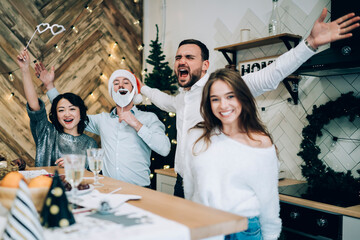 Wall Mural - Laughing friends on Christmas party