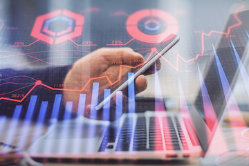Aufkleber - Double exposure of man's hands holding and using a phone and financial graph drawing. Analysis concept.