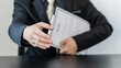 © ArLawKa - The applicant's hand that came forward would hold the hand and the other hand holding the job certificate and his resume.