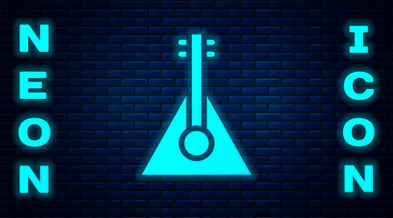 Wall Mural - Glowing neon Musical instrument balalaika icon isolated on brick wall background. Vector.