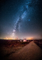Wall Mural - Astronomical observatory and the Milky Way. Arch of the Milky Way on a mountain where there is an astronomical observatory. Milky Way windmills and astronomical observatory. Night landscape milky way