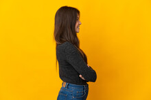 Teenager Brazilian Girl Isolated On Yellow Background In Lateral Position