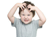 Portrait Of A Boy On A White Background, With A Funny Expression. The Child Pretended To Be Angry And Raised His Hands To His Head. Tries To Scare. Horizontal Photo.