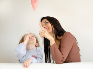 Attractive woman a cute lovely girl looking at a heart in front of a white blank wall.
4216 x 3136 px
35 cm x 26 cm
300 dpi
