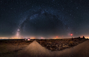 Wall Mural - Beautiful image of an astronomical observatory and the Milky Way. Arch of the Milky Way on a mountain where there is an astronomical observatory. Milky Way, windmills and astronomical observatory. 