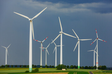 a storm is coming above a bunch of wind mills, Lausitz, Saxony