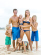 © Jessica Peterson/Tetra Images - Parents with four children (12-17 months, 4-5, 6-7, 8-9) at beach