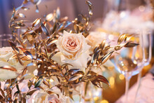 Beautiful Wedding Ceremony Interior And Table Decor, Flower Decoration With Flowers Bouquet, With Roses, Tulips, Peonies In Pink And Golden Color Tones