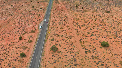 Poster - Countryside road through the fabulous Monument Valley in summser season, aerial view from drone