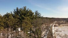 Rustic Landscape, Road In Winter. Camera (drone) Moves Upward. Aerial View