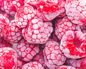 Wall Mural - close up of frozen raspberries on background