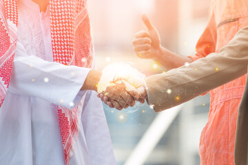 Business and Office concept - Arab and business man are shaking hand on cityscape background