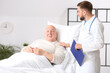 © Pixel-Shot - Doctor and senior man undergoing course of chemotherapy in clinic. Prostate cancer awareness concept