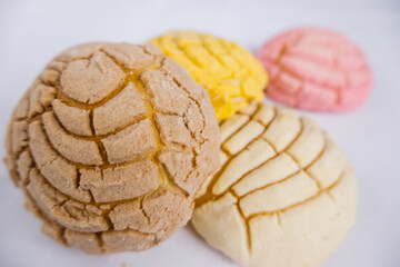 Colorful Mexican sweet bread on a white table