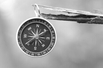 Classic navigation compass on natural background as symbol of tourism with compass, travel with compass and outdoor activities with compass