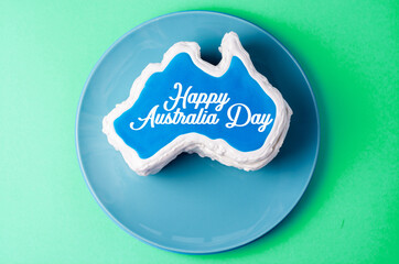 Wall Mural - Happy Australia Day message greeting card - vanilla cream cake in a shape of the Australia
