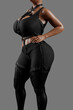 © PixlMakr - Sensual woman in black latex costume and leather straps