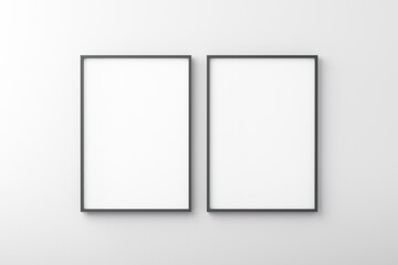 Thin black empty frame on white wall