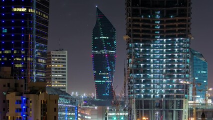 Poster - Kuwait City skyline with Skyscrapers night timelapse in Kuwait City downtown illuminated at dusk, Middle East. Aerial view from rooftop