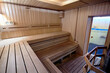 © R_Yosha - Russian sauna wooden bathhouse with stove and glass door to font. Bath and sauna are good means of preventing disorders of cardiovascular and respiratory systems.