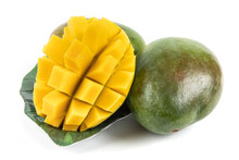 A Large Ripe Green Mango Cut Open And Scored With A Knife To Loosen The Sweet Yellow Meat