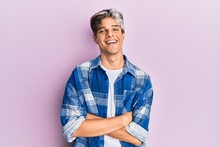 Young Hispanic Man Wearing Casual Clothes Happy Face Smiling With Crossed Arms Looking At The Camera. Positive Person.