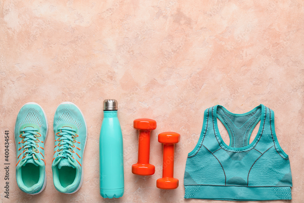 Set of sport equipment on color background