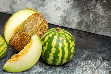 front view fresh melon with watermelon on a dark-light background food fruit ripe photo