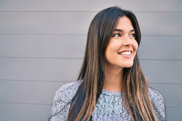 Poster - Young beautiful hispanic girl smiling happy walking at the city.